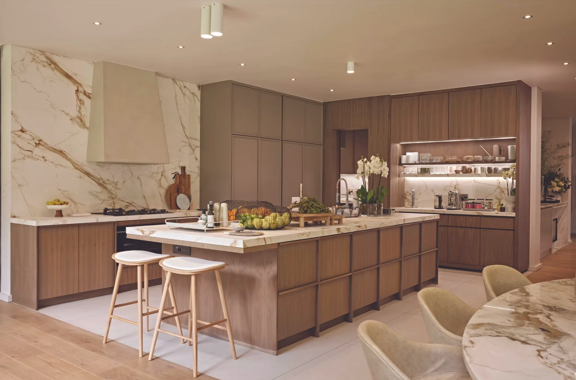 A warm walnut and marble Kitchen Studio residential kitchen